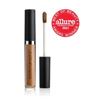 Skin Slip Full Coverage Concealer #D1 Golden Dark by Bodyography open with applicator.