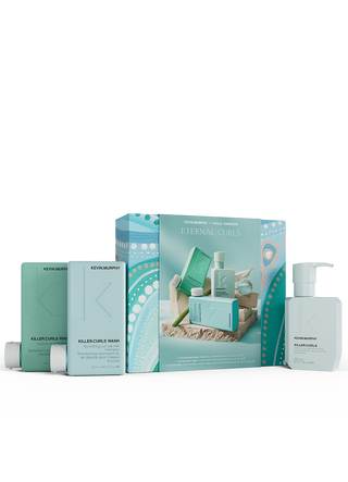 Set of Kevin Murphy hair care products including bottles and boxes on a white background