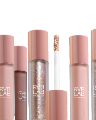 Collection of RVB LAB makeup products on a light gray background