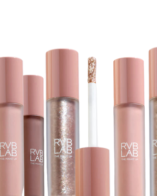 Collection of RVB LAB makeup products on a light gray background