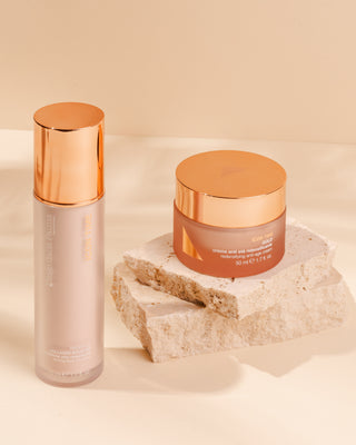 Skincare products with rose gold accents on a neutral background