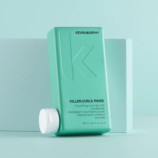 Kevin Murphy Killer Curls Rinse conditioner in a 250ml bottle in front of a light blue background.