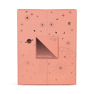 Salmon pink colour skincare box with celestial pattern on white background