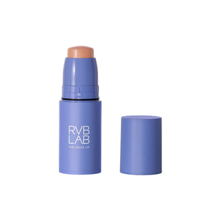 Purple RVB LAB makeup stick with the medium-light toned cream tip exposed, shown upright beside its matching cap.
