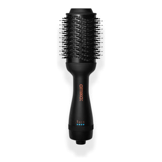Amika H(air) Blow Dryer Brush, a round hot air brush for volumizing and smoothing hair.
