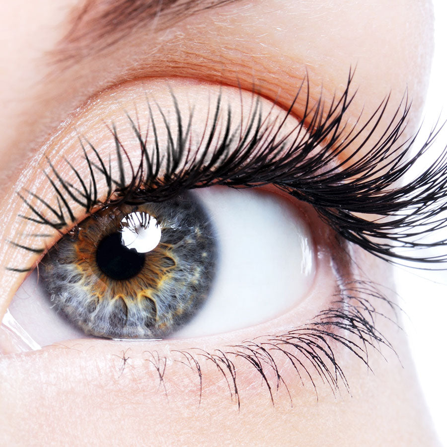 Close-up of a person's eye with long eyelashes