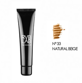 Illuminating Light Foundation in shade 33 Natural Beige by RVB The Makeup, shown in a sleek black tube with a swatch. 